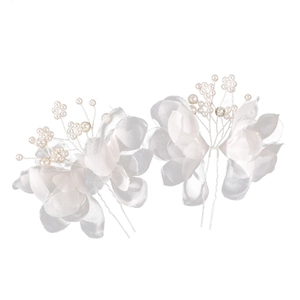 Detail of white chiffon flower hair pins with faux pearl stamens for bridal updos