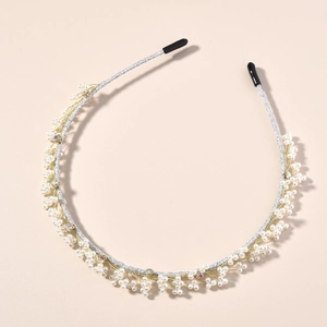 Detail of Korean style handmade pearl headband with golden wire and silver fabric wrap