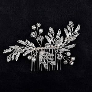 Detail of silver bridal hair comb featuring alloy leaves, clear rhinestones and pearls