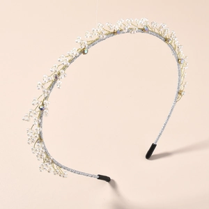 Elegant silver bridal headband featuring handmade white pearls and sparkling rhinestones