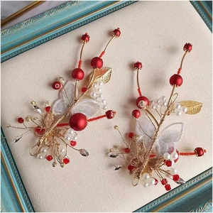 Exquisite handmade red wedding hair accessory with golden leaves and butterfly wings