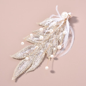 Exquisite bridal feather hair clip with white pearls and silver sequins for weddings