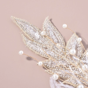Handmade bridal hair clip with white lace leaves, sequins, pearls and feathers for weddings