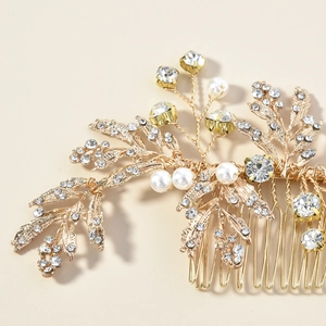 Detailed macro view of the golden leaf hair comb with artificial pearls and crystals