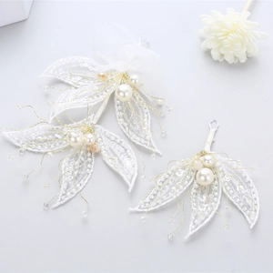 Set of two white sequin leaf bridal hair pins with pearls and crystals for weddings
