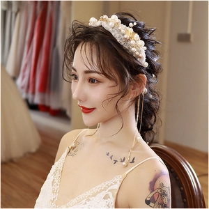 Elegant pearl bridal headband and tassel earrings set with sequins and floral details