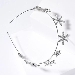 Silver bridal tiara with sparkling crystal stars and snowflakes on a metal headband