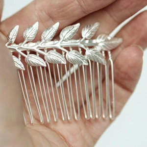 Silver vintage metal leaf bridal hair comb with detailed veins for wedding hairstyles