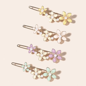 Set of 4 colorful floral hair clips with star and moon enamel finish on metal base