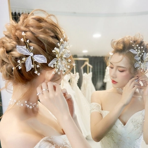 Handmade bridal hair pins set with gold leaf petals and white pearls for wedding hair
