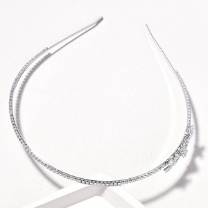 Elegant bridal silver headband with sparkling rhinestones and a delicate crystal bow