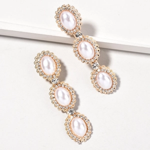 Elegant gold drop earrings with triple oval pearls and sparkling rhinestones for brides