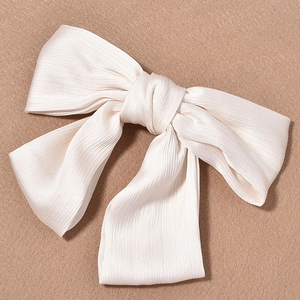 Elegant cream-colored pleated chiffon oversized bow hair clip for wedding or bridal parties