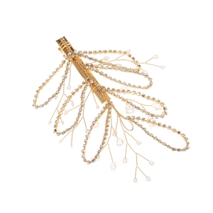 Detail of golden bridal hair clip with rhinestone tassels and delicate pearl accents