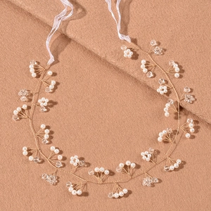 Elegant gold bridal hair vine with white pearls and crystals on soft ribbon band