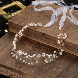 Elegant bridal hair vine with white pearls and crystals on a gold wire with organza ribbons