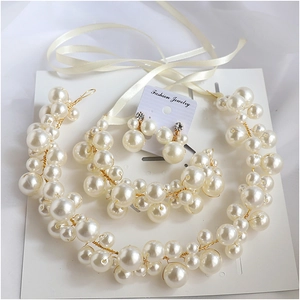 Handmade bridal pearl hairband and clip-on earrings set with elegant cream ribbons