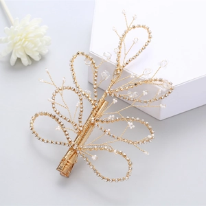 Detailed macro view of bridal hair clip with gold wire pearls and sparkling crystals