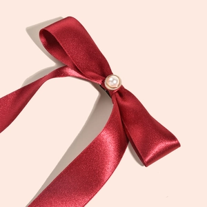 Elegant burgundy velvet ribbon hair clip with a vintage pearl center for bridal weddings