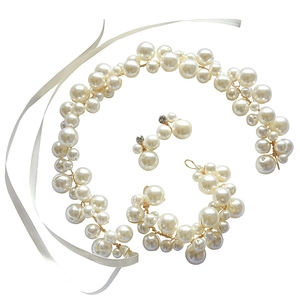 Elegant bridal hair vine and faux pearl jewelry set with bracelet and earrings in gold finish