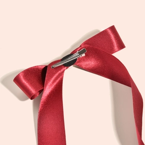 Elegant burgundy velvet texture bridal bow hair clip with luxury silk satin finish