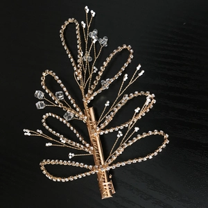 Detailed view of handmade gold flower bridal hair clip with pearls and crystal rhinestones