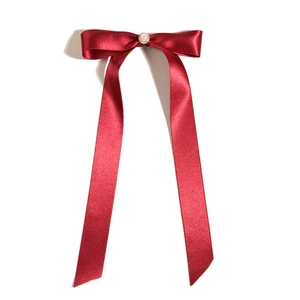 Elegant burgundy velvet bow hair clip with a central pearl for bridal wedding hairstyles
