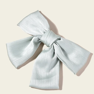 Elegant mint green pleated satin bow hair clip for bridal and bridesmaid hairstyles