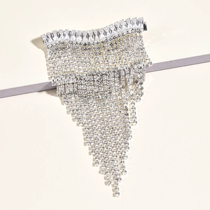 Detailed macro view of sparkling rhinestone fringe bridal hair clip in silver finish