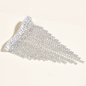 Detailed close-up of bridal rhinestone fringe hair clip with sparkling silver zircon tassels