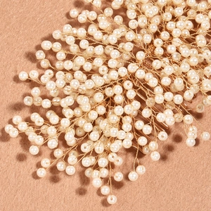 Elegant bridal hair comb with handmade pearls and gold wire floral branch design