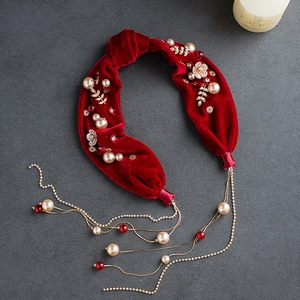 Luxurious red velvet bridal headband with pearls, golden leaves and hanging tassel chains