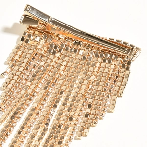 Elegant gold bridal hair clip featuring long sparkling rhinestone fringe tassels