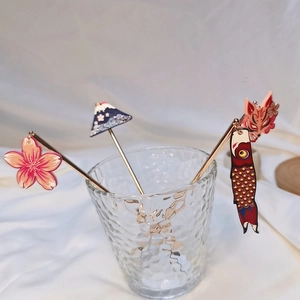 Detailed close-up of Japanese style hairpins with Mount Fuji and cherry blossom charms