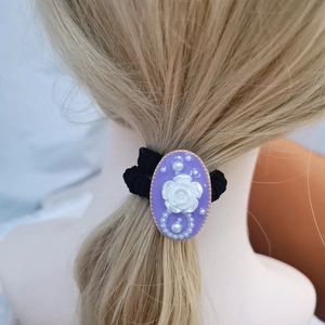 Elegant purple oval hair tie with white resin rose and pearls on black scrunchie