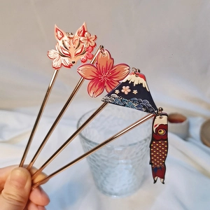 Detail view of 4-piece Japanese hair sticks featuring Mount Fuji and cherry blossom charms