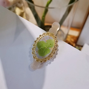 Handmade clover hair clip with real pressed flower and gold foil in vintage gold frame