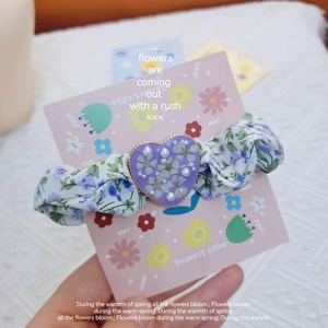 French floral scrunchie with purple heart-shaped dried flower and pearl ornament