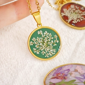 Handmade stainless steel necklace with round dried flower pendants in various colors