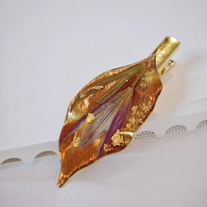 Handmade leaf hair clip with purple dried flowers and gold leaf foil details