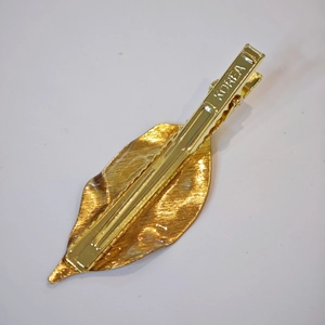 Handmade gold leaf hair clip with realistic vein texture and duckbill clip design