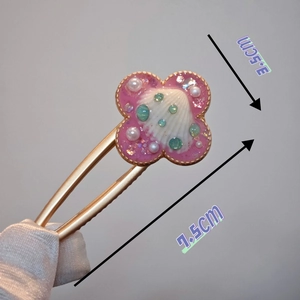 Handmade ocean style floral hair clip with pink resin and seashells measuring 7.5cm