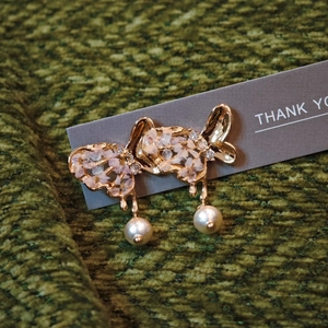 Elegant handmade gold butterfly earrings with pink flower petals and hanging pearls