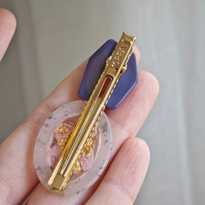 Purple hexagonal preserved flower hair clip with gold foil inside clear resin