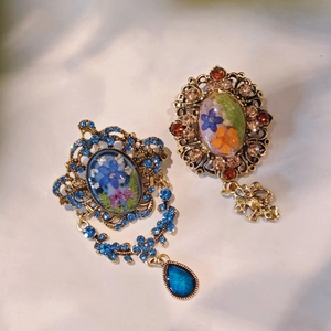 Vintage Baroque style brooches with colorful floral patterns and crystal rhinestones