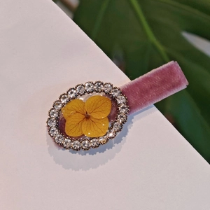 Handmade velvet hair clip with preserved yellow hydrangea and sparkling crystals
