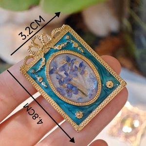 Vintage French baroque enamel brooch with blue dried flowers and gold foil elements