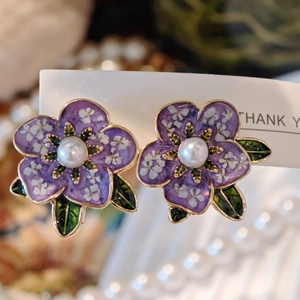 Vintage purple flower petal earrings with pearl center and gold leaf detail
