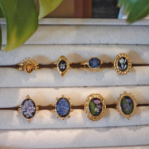 Handmade pressed flower rings in gold resin with natural dried botanical specimens