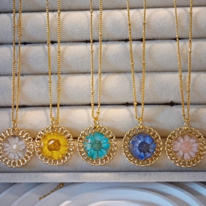 Set of five handmade gold necklaces with round floral resin pendants and dried flowers